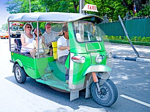 Tourist on '' tuk tuks '' in Bangkok photo