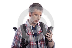 Tourist Using a Cell Phone to Call for a Rideshare