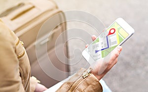 Tourist using map in phone app to navigate and find location. photo