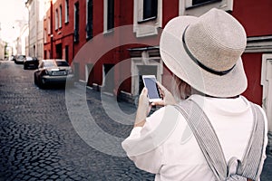 Tourist using navigation app on the mobile phone. Travel concept