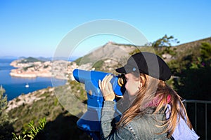 Tourist using telescope