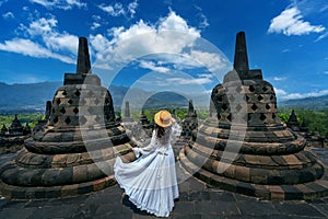 Tourist visiting in ancient largest Buddhist Borobudur Temple in Java Indonesia