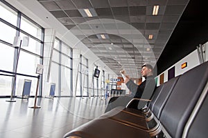 Tourist in waiting area in the airport