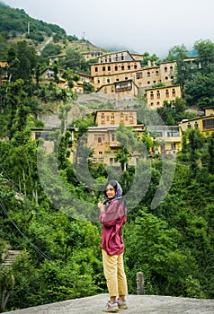 Tourist walk around Masuleh historical village in north east Iran - popular famous tourism destination in persia