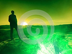 Tourist walker in landscape with blue sky sunset over horizon