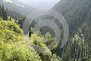 Tourist walking, Kulsay lake summer day mountains view