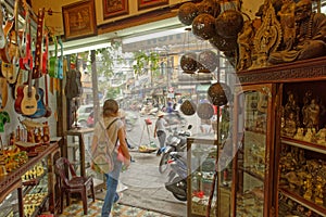 Tourist walking out of handcrafts shop