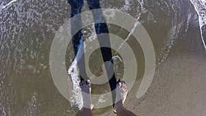 Tourist walking on the shore