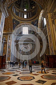 tourist walking in St. Peter basilica cathedral vatican