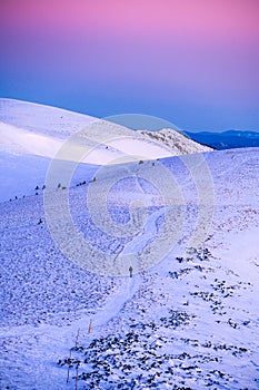 Tourist walking on the white snowy mountains ridge Fatra, Slovakia