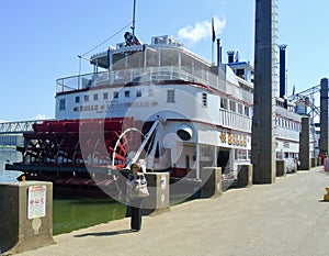 A Tourist walks in front of the Belle of Louisville, Louisville Kentucky