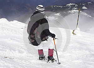 Tourist in a winter mountain