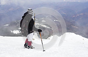 Tourist in a winter mountain