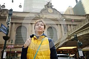 Tourist woman on the background of Grand Central Station Terminal building exterior on spring day, 42nd Street in midtown of photo
