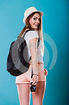 Tourist woman with backpack side view