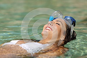 Tourist woman bathing on a tropical beach on holidays