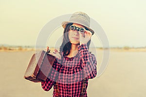 Tourist woman with binoculars