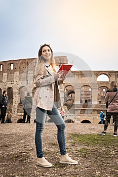 Tourist woman at colosseum monument in Rome