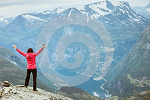 Tourist woman on Dalsnibba viewpoint Norway