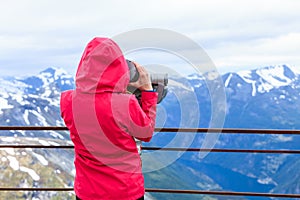 Tourist woman on Dalsnibba viewpoint Norway