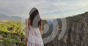 Tourist woman on the edge of a cliff of Tazi Canyon in Manavgat, Antalya, Turkey. Greyhound Canyon, Wisdom Valley.