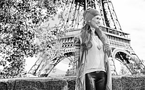 Tourist woman on embankment near Eiffel tower having excursion