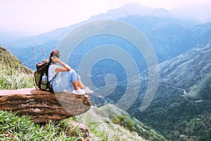 Tourist woman enjoy with beautiful view on mountains and valley in Ella, Sri Lanka, Little Adam Peak photo