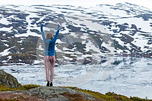 Tourist woman enjoying mountain landscape in Norway