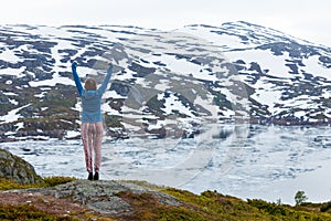 Tourist woman enjoying mountain landscape in Norway