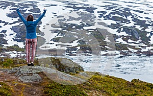 Tourist woman enjoying mountain landscape in Norway