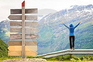 Tourist woman enjoying mountains landscape in Norway.