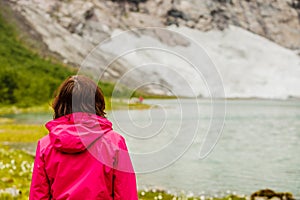 Tourist woman enjoying mountains landscape in Norway.