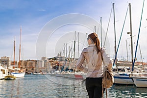 Tourist woman in French historical city Marseille and Mediterranean sea coast. Marseille is the biggest port in France, South
