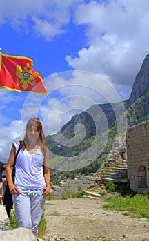 Tourist woman hiking in old Montenegro fortress