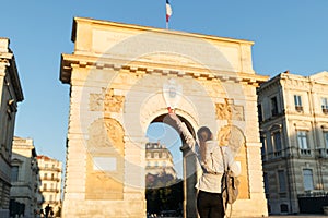 Tourist woman in historical city Montpellier in France, South Europe. Famous large city and tourist destionation photo