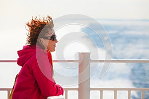 Tourist woman on liner seascape background