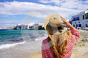 Tourist woman in Little Venice Beach on Mykonos Island, Greece, Europe