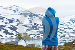 Tourist woman in mountains Norway