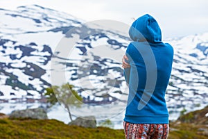 Tourist woman in mountains Norway