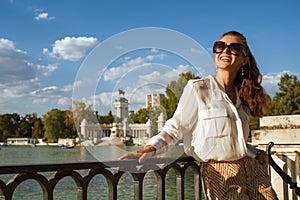 Tourist woman at Parque del Buen Retiro looking into distance
