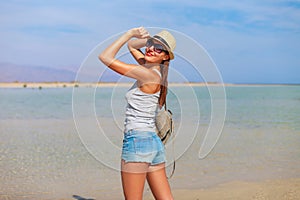 Tourist woman at the Red Sea coast and mangroves in the Ras Mohammed National Park. Famous travel destionation in desert. Sharm el