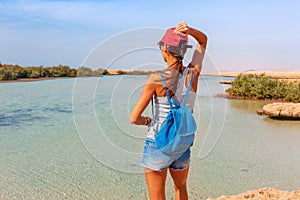 Tourist woman at the Red Sea coast and mangroves in the Ras Mohammed National Park. Famous travel destionation in desert. Sharm el photo