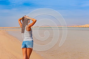 Tourist woman at the Red Sea coast in the Ras Mohammed National Park. Famous travel destionation in desert. Sharm el Sheikh, Sinai photo