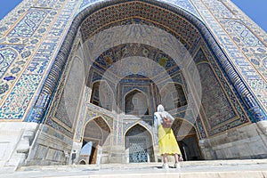 tourist woman in Registan square Samarkand, Uzbekistan