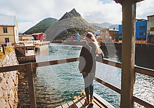 Tourist woman sightseeing Nyksund village in Norway travel lifestyle vacations