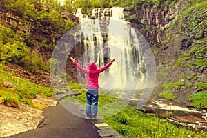 Tourist woman by Skjervsfossen Waterfall - Norway