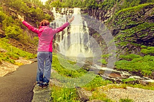 Tourist woman by Skjervsfossen Waterfall - Norway