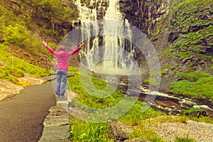 Tourist woman by Skjervsfossen Waterfall - Norway