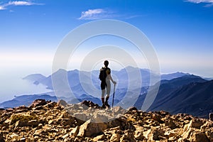 Tourist woman on the top of mount,