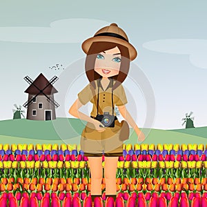 Tourist woman in the tulip field in Holland